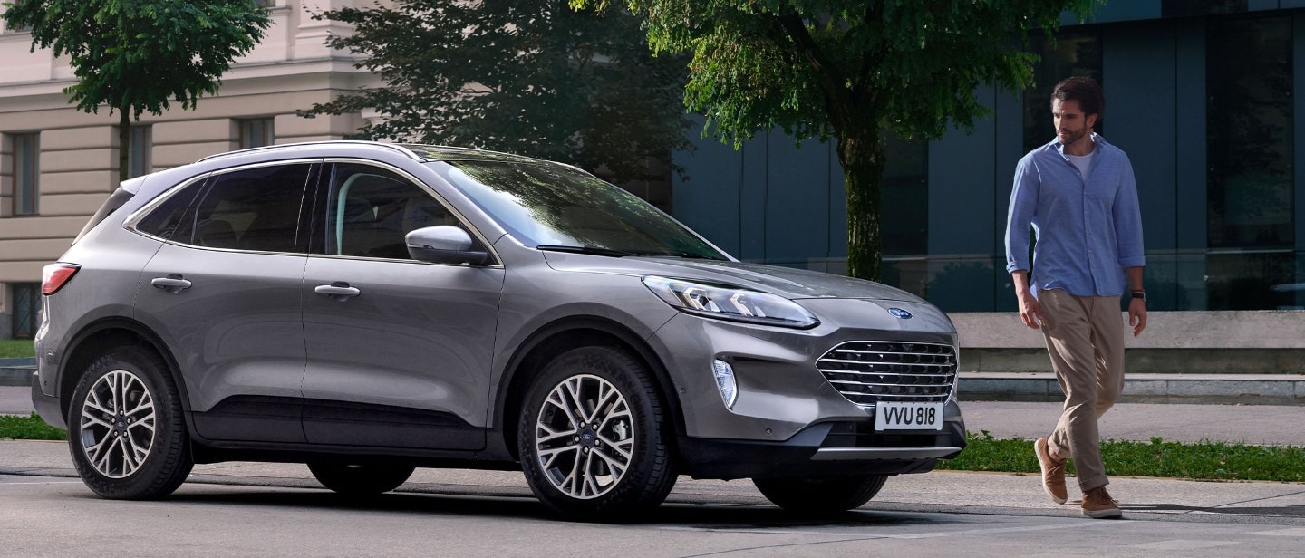 ford servicing eu extended_warranty 21x9 2160x925 bb Features Desktop man walking away from parked ford kuga